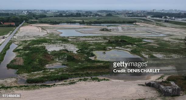 This picture taken on June 9, 2018 shows the site the site of the former "Jungle" migrant camp in Calais, northern France. - The former "Jungle" of...