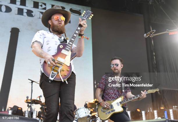 John Osborne and T.J. Osborne of Brothers Osborne perform during the 2018 Bonnaroo Music & Arts Festival on June 10, 2018 in Manchester, Tennessee.