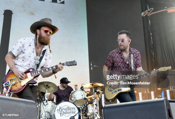 John Osborne and T.J. Osborne of Brothers Osborne perform during the 2018 Bonnaroo Music & Arts Festival on June 10, 2018 in Manchester, Tennessee.