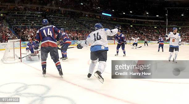Ville Peltonen of Finland celebrates the goal of Olli Jokinen during the ice hockey men's bronze medal game between Finland and Slovakia on day 16 of...