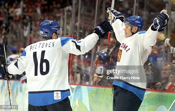 Olli Jokinen of Finland celebrates his goal with Ville Peltonen during the ice hockey men's bronze medal game between Finland and Slovakia on day 16...