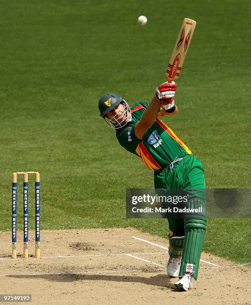 Michael Dighton of the Tigers smashes Damien Wright of the Bushrangers straight down the ground during the Ford Ranger Cup Final match between the...