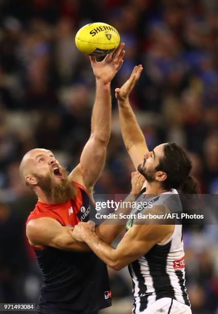 Max Gawn of the Demons and Brodie Grundy of the Magpies compete for the ball during the round 12 AFL match between the Melbourne Demons and the...