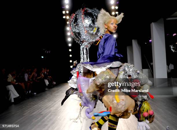 Model walks the runway at the Charles Jeffrey Loverboy show during London Fashion Week Men's June 2018 at the BFC Show Space on June 11, 2018 in...