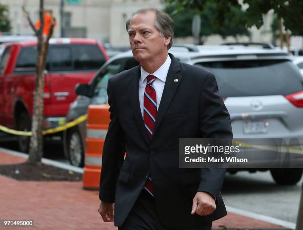 James Wolfe, former director of security for the Senate Intelligence Committee walks in to the Washington FBI Field Office to be processed on June...