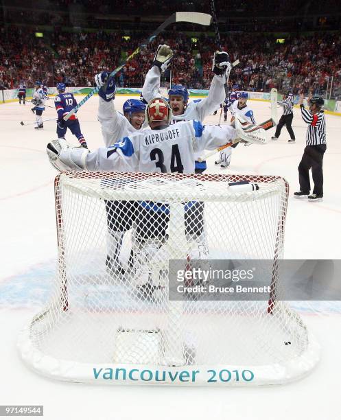 Miikka Kiprusoff of Finland celebrates with his team after defeating Slovakia to win the bronze medal in men's ice hockey on day 16 of the Vancouver...