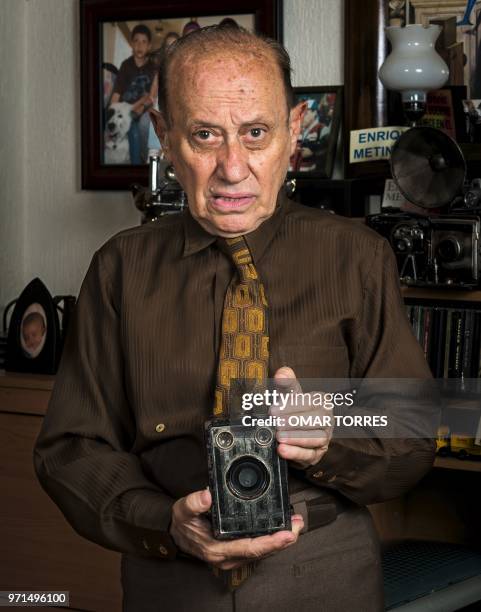 Mythical Mexican photographer Enrique Metinides, who covered the "red notes" , poses for pictures with his first camera, a Brownie Junior Six-16,...