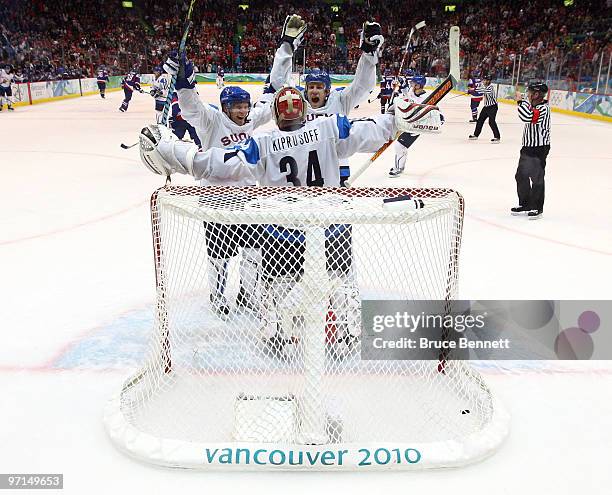 Miikka Kiprusoff of Finland celebrates with his team after defeating Slovakia to win the bronze medal in men's ice hockey on day 16 of the Vancouver...