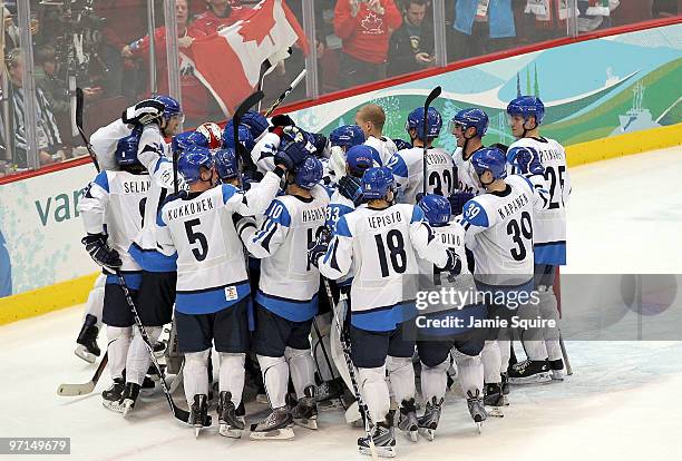 Finland celebrates with his team after defeating Slovakia to win the bronze medal in men's ice hockey on day 16 of the Vancouver 2010 Winter Olympics...