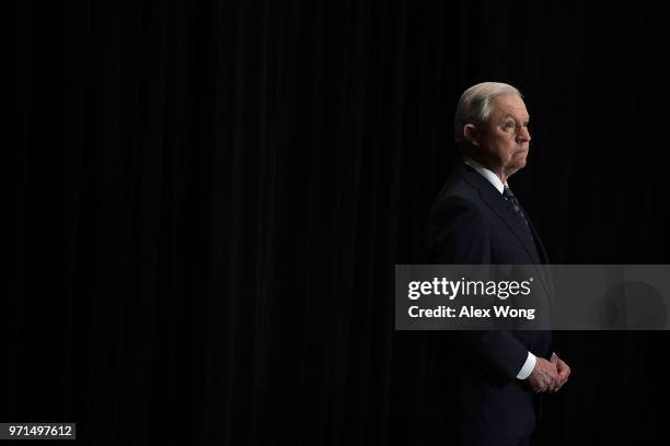 Attorney General Jeff Sessions listens as he is introduced during the Justice Department's Executive Officer for Immigration Review Annual Legal...