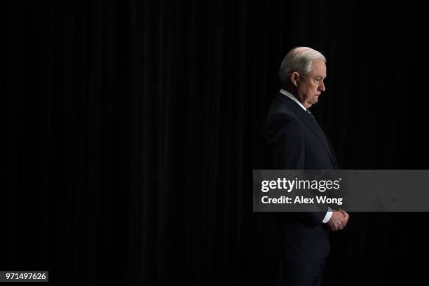 Attorney General Jeff Sessions listens as he is introduced during the Justice Department's Executive Officer for Immigration Review Annual Legal...