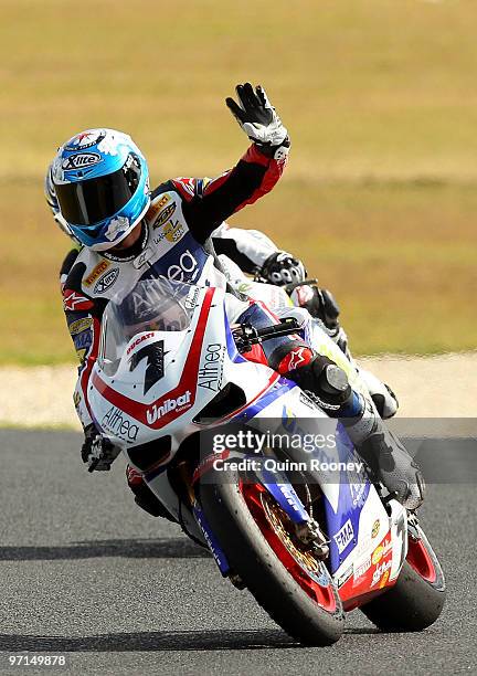 Carlos Checa of Spain and the Althea Racing Team waves to the crowd after winning the Superbike World Championship round one race two at Phillip...