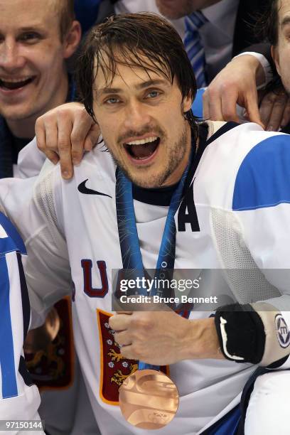 Teemu Selanne of Finland celebrates with his bronze medal after the ice hockey men's bronze medal game between Finland and Slovakia on day 16 of the...
