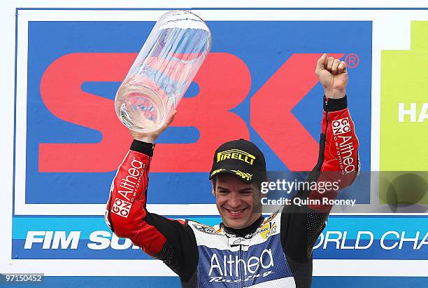 Carlos Checa of Spain and the Althea Racing Team celebrates winning the Superbike World Championship round one race two at Phillip Island Grand Prix...