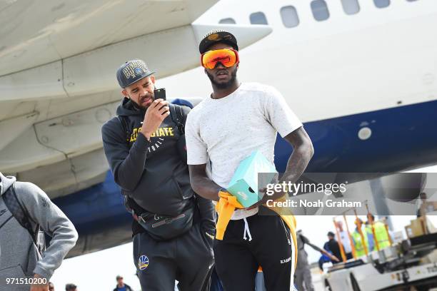JaVale McGee and Jordan Bell of the Golden State Warriors exit the plane at Oakland International Airport on June 11, 2018 in Oakland, California....
