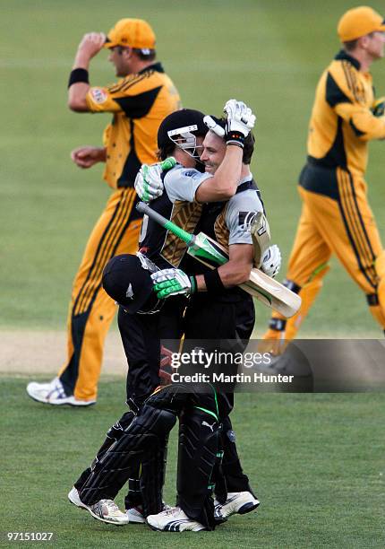 Brendon McCullum of New Zealand celebrates his century with his brother Nathan McCullum during the Twenty 20 International match between the New...