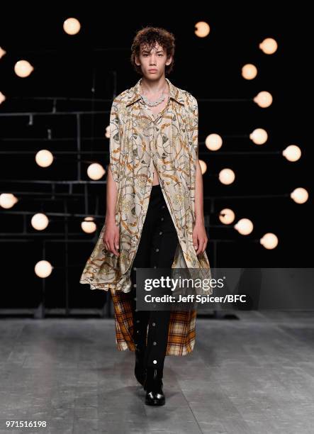 Model walks the runway at the Blindness show during London Fashion Week Men's June 2018 at the BFC Show Space on June 11, 2018 in London, England.