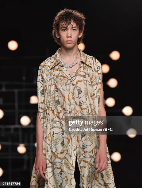 Model walks the runway at the Blindness show during London Fashion Week Men's June 2018 at the BFC Show Space on June 11, 2018 in London, England.