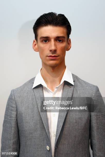 Model poses at the Mr Start presentation at the DiscoveryLAB during London Fashion Week Men's June 2018 at the BFC Show Space on June 11, 2018 in...