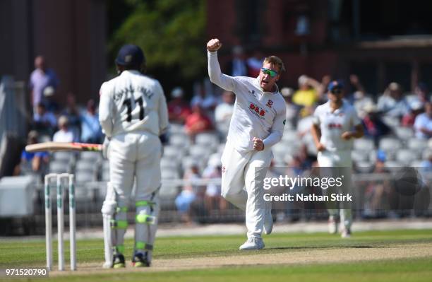 Simon Harmer of Essex celebrates after getting Shivnarine Chanderpau of Lancashire out during the Specsavers Championship Division One match between...