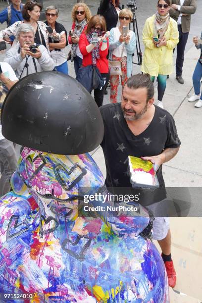 The artist Domingo Zapata restores his artwork, the menina 'La vida es sueno', in front of Queen Sofia Museum on June 11, 2018 in Madrid, Spain. This...