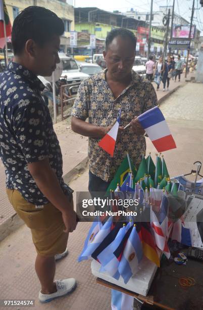 Soccer fan buy flag on street ahead of the FIFA World Cup 2018 in Dimapur, India north eastern state of Nagaland on Monday June 11, 2018.