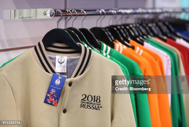 Sports jackets decorated with '2018 FIFA World Cup Russia' stitching sit on display inside an official merchandise store in Moscow, Russia, on...