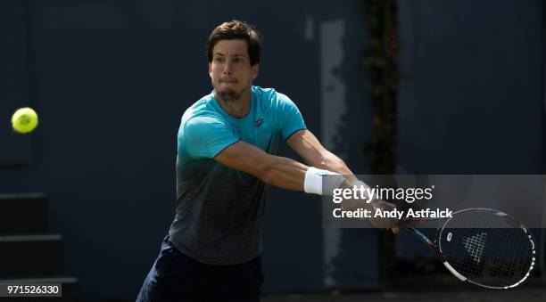 Aljaz Bedene of Slovenia hits a backhand against Marius Copil of Romania during Day One of the Libema Open 2018 on June 11, 2018 in Rosmalen,...