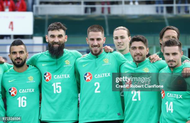 Aziz Behich, Mile Jedinak, Milos Degenek, Dimitri Petratos and Jamie Maclaren of Australia pose after an Australian Socceroos training session at...