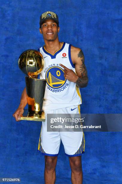 Patrick McCaw of the Golden State Warriors poses for a portrait with the Larry O'Brien Trophy after winning Game Four of the 2018 NBA Finals against...