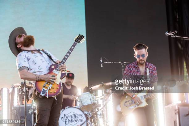 John Osborne and T.J. Osborne of Brothers Osborne perform at the Bonnaroo Music & Arts Festival on June 10, 2018 in Manchester, Tennessee.