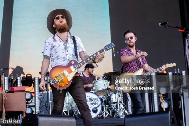 John Osborne and T.J. Osborne of Brothers Osborne perform at the Bonnaroo Music & Arts Festival on June 10, 2018 in Manchester, Tennessee.