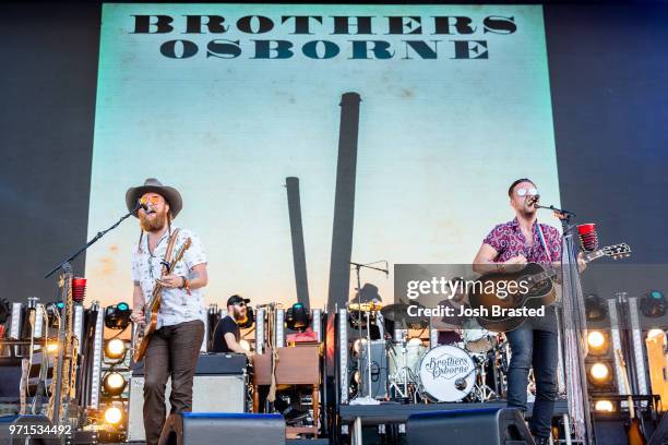 John Osborne and T.J. Osborne of Brothers Osborne perform at the Bonnaroo Music & Arts Festival on June 10, 2018 in Manchester, Tennessee.