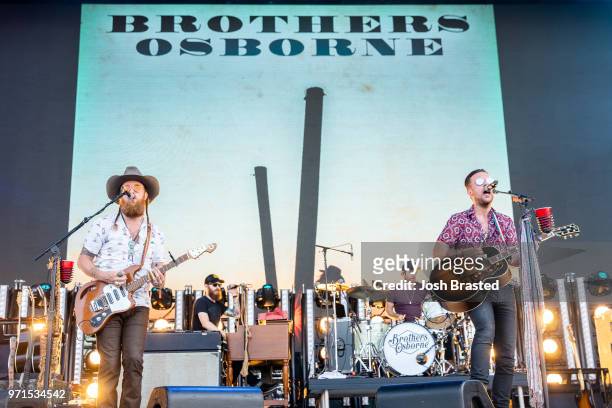 John Osborne and T.J. Osborne of Brothers Osborne perform at the Bonnaroo Music & Arts Festival on June 10, 2018 in Manchester, Tennessee.