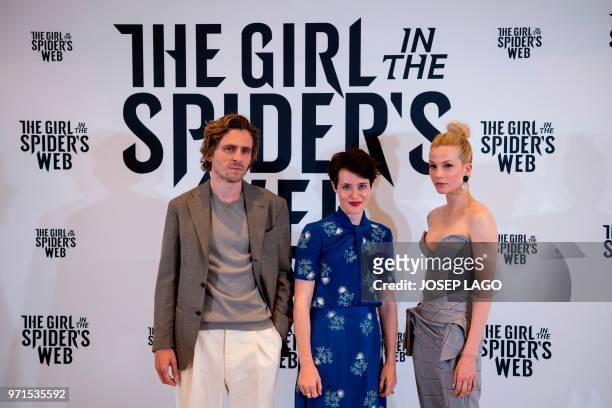 Swedish actor Sverrir Gudnason, British actress Claire Foy and Dutch actress Sylvia Hoeks pose during the photocall for the film "The Girl in the...