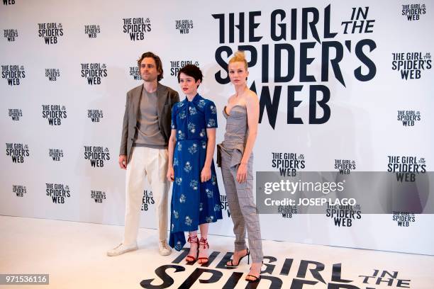 Swedish actor Sverrir Gudnason, British actress Claire Foy and Dutch actress Sylvia Hoeks pose during the photocall for the film "The Girl in the...