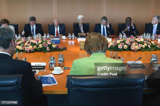 Managing Director of the International Monetary Fund Christine Lagarde and German Chancellor Angela Merkel attend a meeting with the chairmen of...