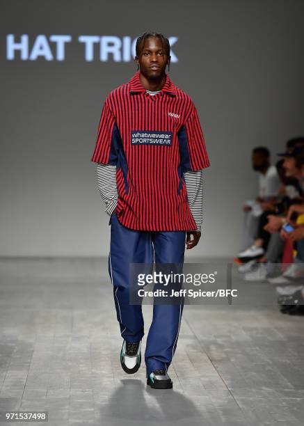 Model walks the runway at the What We Wear show during London Fashion Week Men's June 2018 at the BFC Show Space on June 11, 2018 in London, England.