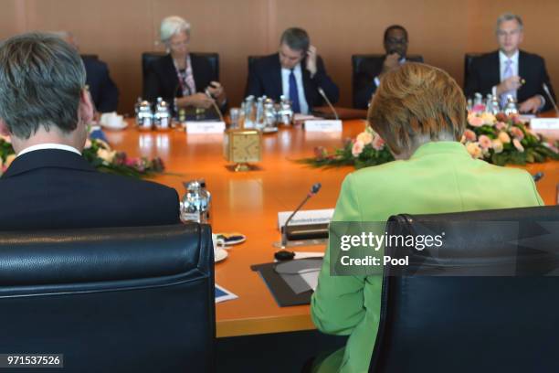 Managing Director of the International Monetary Fund Christine Lagarde and German Chancellor Angela Merkel attend a meeting with the chairmen of...