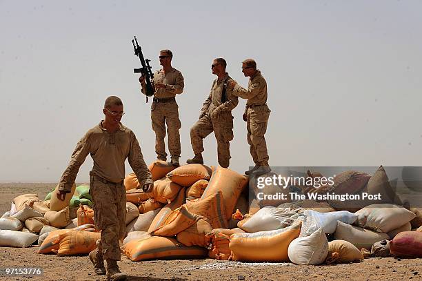 South Afghanistan U.S. Marines from left to right, Lance Cpl. Nathan Dunlap, of Ohio, Major Steve Sutey, Battalion Operations Officer, Charlie...