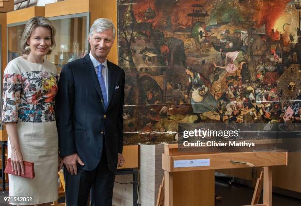 King Philip of Belgium and Queen Mathilde visit the restoration works of the paintings Mad Meg by Pieter Breughel de Elder and the Four Compositions...