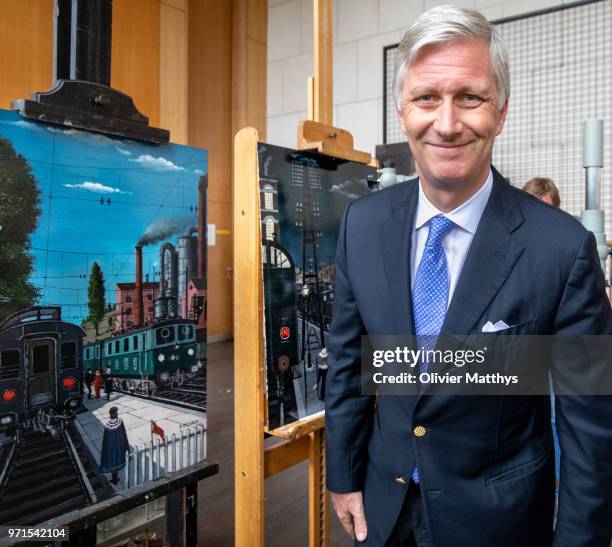 King Philip of Belgium and Queen Mathilde visit the restoration works of the paintings Mad Meg by Pieter Breughel de Elder and the Four Compositions...