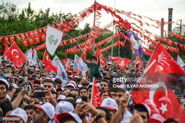 People attend a campaign meeting of Presidential candidate of Turkey's main opposition Republican People's Party , Muharrem Ince in Diyarbakir on...