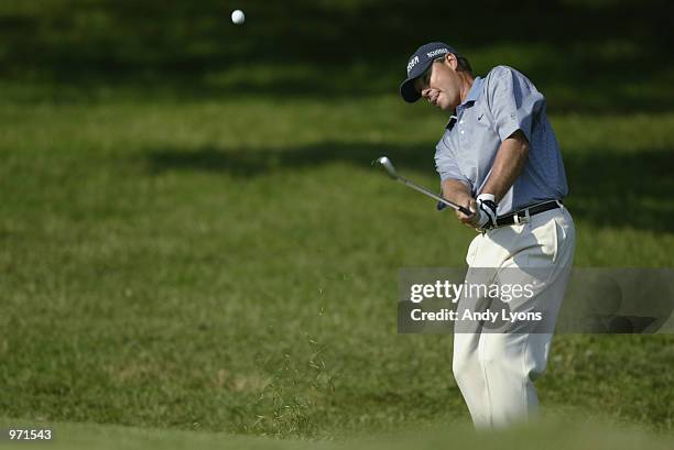 John Cook hits out of the rough on the 15th hole during the second round of the Advil Western Open July 5, 2002 at Cog Hill Golf and Country Club in...