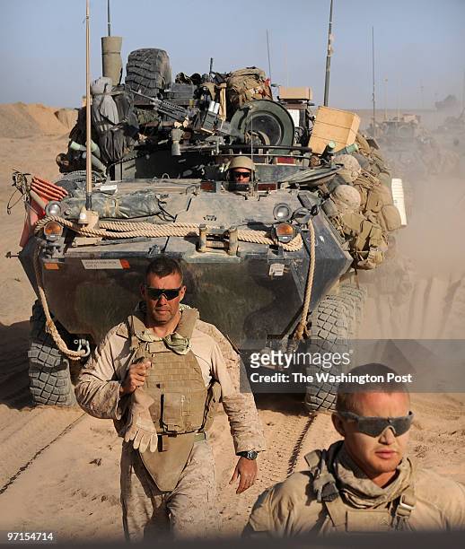 South Afghanistan U.S. Marines First Sgt. Julio Meza left, of Rushville, New York, and Cpl. Matt Worley of Sunbury, Ohio, guide their Light Armor...