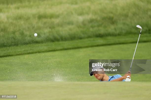 Xander Schauffele of the United States plays a shot from a bunker during practice rounds prior to the 2018 U.S. Open at Shinnecock Hills Golf Club on...