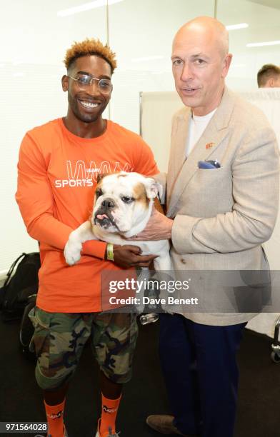 Tinie Tempah with dog Pablo, and Dylan Jones attend the What We Wear show during London Fashion Week Men's June 2018 at the BFC Show Space on June...