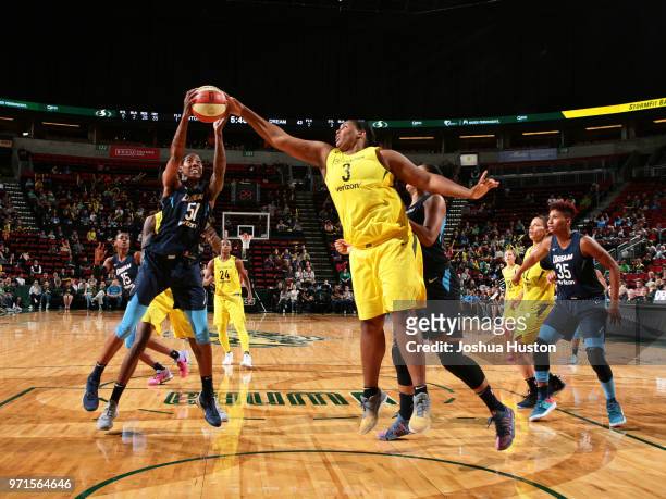 Jessica Breland of the Atlanta Dream handles the ball against Courtney Paris of the Seattle Storm during the game on June 10, 2018 at KeyArena in...