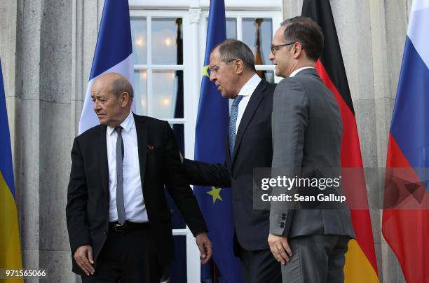 French Foreign Minister Jean-Yves Le Drian, Russian Foreign Minister Sergey Lavrov and German Foreign Minister Heiko Maas depart after a group photo...