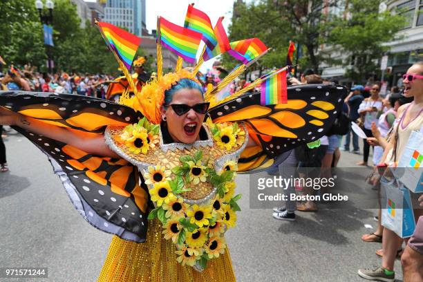 Woman in a butterfly outfit marches down Boylston Street during the annual Boston Pride Parade, which took place through the streets of the Back Bay...